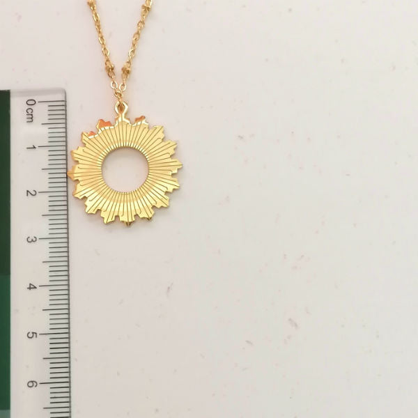 collier long soleil acier doré